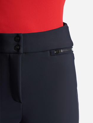High waistband, zippered hip pockets, center front fly with snaps, zippered hip pockets
